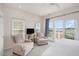 Cozy bedroom with a sunny view from the balcony and comfortable seating at 126 W 2Nd St, Folly Beach, SC 29439