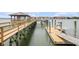 Picturesque dock with a wooden walkway, boat slips, and a covered gazebo, offering a relaxing waterfront experience at 126 W 2Nd St, Folly Beach, SC 29439