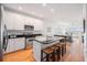Modern kitchen with stainless steel appliances, a granite countertop, and a breakfast bar at 126 W 2Nd St, Folly Beach, SC 29439