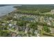 Aerial view of a charming community with a serene pond and lush greenery at 133 Wando Reach Rd, Wando, SC 29492