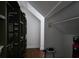 An attic space with white walls, storage shelves and triangular ceiling at 133 Wando Reach Rd, Wando, SC 29492