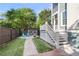 Charming backyard features a decorative fence, pea gravel, and charming patio furniture at 133 Wando Reach Rd, Wando, SC 29492