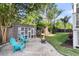 Landscaped backyard features a decorative fence, pea gravel, and charming patio furniture at 133 Wando Reach Rd, Wando, SC 29492