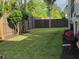 Well-kept backyard featuring a green lawn, a privacy fence, and flower beds for natural beauty at 133 Wando Reach Rd, Wando, SC 29492