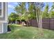 Spacious backyard featuring a well-maintained lawn and a brown wood fence at 133 Wando Reach Rd, Wando, SC 29492