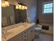 Bathroom with double sinks, ample counter space, and a soaking tub for a luxurious experience at 133 Wando Reach Rd, Wando, SC 29492