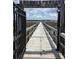 Picturesque view of a wooden dock leading to a tranquil waterway at 133 Wando Reach Rd, Wando, SC 29492