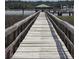 Scenic view of a long wooden dock and waterfront at 133 Wando Reach Rd, Wando, SC 29492