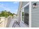 A relaxing porch with a sliding glass door that looks out to a beautiful nature view at 133 Wando Reach Rd, Wando, SC 29492