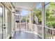 Inviting screened porch with great natural light and wooded views at 133 Wando Reach Rd, Wando, SC 29492