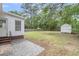 A large grassy backyard features a storage shed and privacy fence at 1534 Salisbury St, Charleston, SC 29407