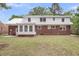 Large backyard with a combination of brick and white siding, offering ample outdoor space at 1534 Salisbury St, Charleston, SC 29407