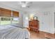 Bright bedroom featuring hardwood floors and access to an attached bathroom at 1534 Salisbury St, Charleston, SC 29407