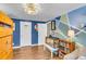 Stylish bedroom featuring blue walls, hardwood floors, and a unique geometric design accent wall at 1534 Salisbury St, Charleston, SC 29407