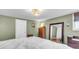 Bedroom featuring green walls, wood floors, and a mirrored door for an expanded sense of space at 1534 Salisbury St, Charleston, SC 29407