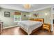Inviting bedroom with hardwood floors, a comfortable bed, and natural lighting from the window at 1534 Salisbury St, Charleston, SC 29407