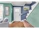 Stylish entryway with hardwood floors, staircase, and soothing color palette at 1534 Salisbury St, Charleston, SC 29407