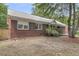 Charming brick home with lush landscaping and well-manicured lawn at 1534 Salisbury St, Charleston, SC 29407