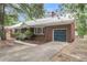 Traditional brick home with attached garage, well-maintained lawn, and concrete walkway at 1534 Salisbury St, Charleston, SC 29407