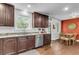 Bright kitchen featuring stainless steel appliances, granite countertops, and a dining area at 1534 Salisbury St, Charleston, SC 29407