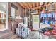 Unfinished laundry room featuring brick steps, washer and dryer, and doorway at 1534 Salisbury St, Charleston, SC 29407
