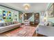 Inviting living room with stylish decor, colorful rug, and a unique stained glass window at 1534 Salisbury St, Charleston, SC 29407