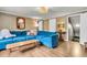 Cozy living room features wood floors, a comfortable blue couch, and an open layout at 1534 Salisbury St, Charleston, SC 29407
