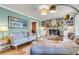 Cozy living room with a brick fireplace, built-in shelves, and hardwood floors at 1534 Salisbury St, Charleston, SC 29407