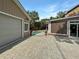 Backyard featuring a detached garage and a pool with a relaxing outdoor patio at 16 Charlyn Dr, Charleston, SC 29407