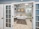 Bright bathroom featuring a clawfoot tub, marble floors, and a tiled glass shower at 16 Charlyn Dr, Charleston, SC 29407