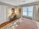 Bedroom featuring a bed, windows, and hardwood floors at 16 Charlyn Dr, Charleston, SC 29407