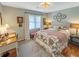 Cozy bedroom featuring a comfortable bed, a window, and hardwood floors at 16 Charlyn Dr, Charleston, SC 29407