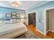 Serene main bedroom with hardwood floors, ensuite and closet, and soothing color palette at 16 Charlyn Dr, Charleston, SC 29407