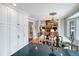 Inviting dining room showcasing hardwood floors, stylish chandelier, and a view of the living room fireplace at 16 Charlyn Dr, Charleston, SC 29407