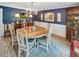 Cozy dining room with blue walls, a chandelier, and a hardwood table at 16 Charlyn Dr, Charleston, SC 29407