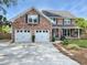 Attractive brick home with a two-car garage and a beautifully landscaped front yard at 16 Charlyn Dr, Charleston, SC 29407