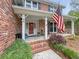 Inviting front porch featuring a comfortable seating area and charming curb appeal at 16 Charlyn Dr, Charleston, SC 29407