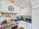 Gourmet kitchen featuring a stainless steel range, white cabinetry, and stylish subway tile backsplash at 16 Charlyn Dr, Charleston, SC 29407