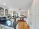 Modern kitchen with stainless steel appliances, white cabinets and hardwood floors at 16 Charlyn Dr, Charleston, SC 29407