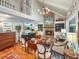 Spacious living room with vaulted ceiling, fireplace, and upstairs loft at 16 Charlyn Dr, Charleston, SC 29407