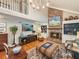 Bright living room with brick fireplace, built-ins, and vaulted ceiling at 16 Charlyn Dr, Charleston, SC 29407