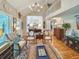 Inviting living room with vaulted ceilings, wood floors, and elegant decor at 16 Charlyn Dr, Charleston, SC 29407
