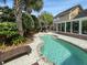 Backyard swimming pool with a lounge chair and patio, surrounded by mature landscaping at 16 Charlyn Dr, Charleston, SC 29407