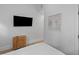 Modern bedroom featuring a flat screen TV, wood style dresser, and white bedding at 177 Spring St, Charleston, SC 29403