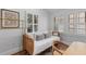 Bright bedroom with daybed, natural light from shuttered windows, and unique decor at 177 Spring St, Charleston, SC 29403