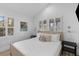 Bright bedroom with white walls, shuttered windows, and cozy bedding at 177 Spring St, Charleston, SC 29403