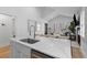 Modern kitchen featuring a large island, stainless steel appliances, and an open layout to living area at 177 Spring St, Charleston, SC 29403