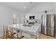 Modern kitchen showcasing an island with seating, stainless steel appliances, and contemporary finishes at 177 Spring St, Charleston, SC 29403