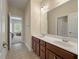 Well-lit bathroom with a double sink vanity, large mirror, and tile flooring at 1781 Tennyson # 6, Mount Pleasant, SC 29466
