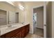 Well-lit bathroom with a double sink vanity, large mirror, and an adjacent room at 1781 Tennyson # 6, Mount Pleasant, SC 29466